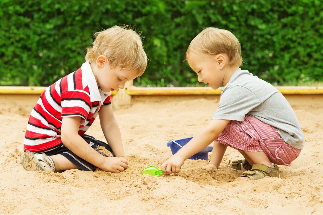 Children infected with worms in the sandbox